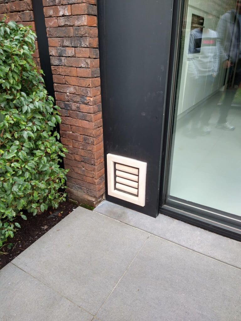 Dog door online in brick wall